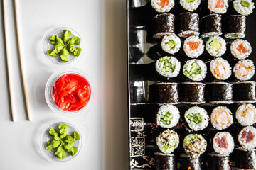 Set of sushi and maki roll on dark background .Top view