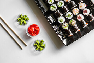 Set of sushi and maki roll on dark background .Top view
