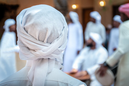 Emarati locals ( GCC - Gulf ) celebrating in their traditional way and dancing their traditional emirati yola dance