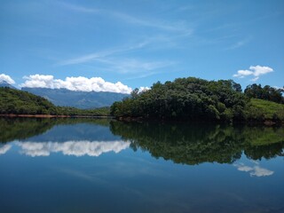 Neyyar dam reservoir, Thiruvananthapuram, Kerala, blue sky background, landscape view