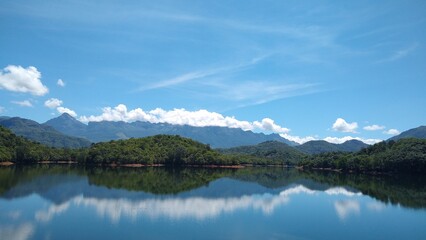 Naklejka na ściany i meble Neyyar dam reservoir, Thiruvananthapuram, Kerala, blue sky background, landscape view