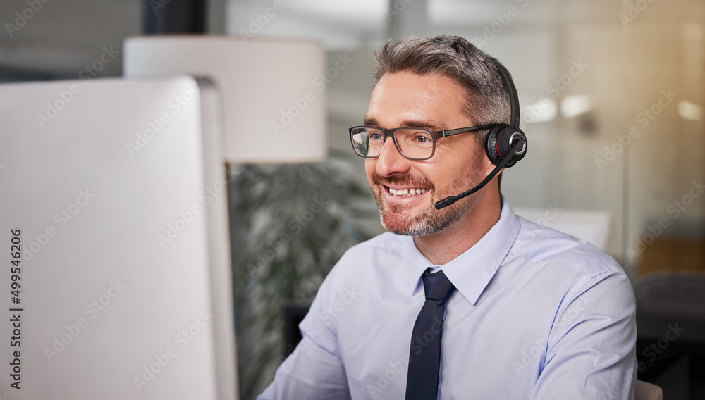 Poster Want my advice Never keep the client waiting. Shot of a call centre agent wearing a headset while working on his computer.