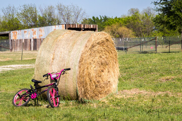 Obraz premium hay bales on a farm and a bike