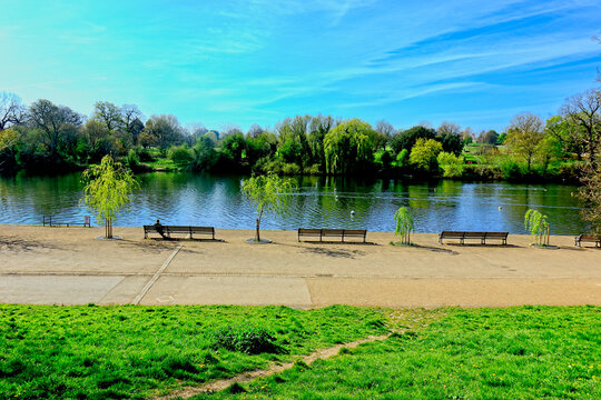 A Scenic Landscape Overlooking The L;ake At Mote Park