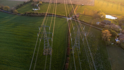An aerial view of electricity pylons in rural Suffolk, UK
