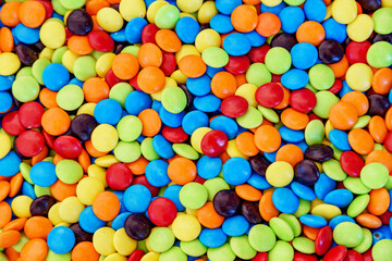 Fototapeta na wymiar Closeup view of colorful small candies. Beautiful sweets