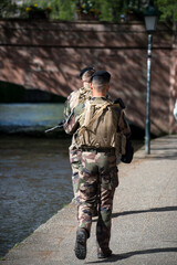 Strasbourg - France - 16 April 2022 - Portrait on back view of french soldiers patrolling in the street