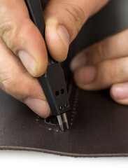master works with hands with leather details