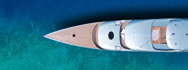 Aerial drone top view ultra wide photo of large yacht anchored in tropical exotic paradise with...