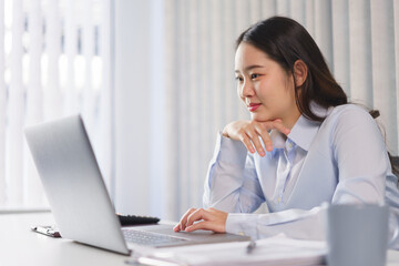 Business concept, Businesswoman thoughtful about new project while reading marketing data on laptop