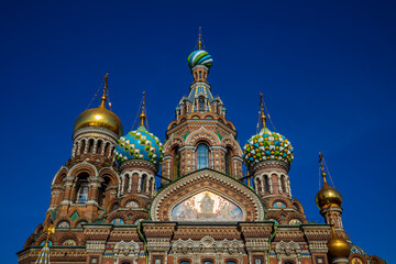 Fototapeta na wymiar Detail of the richly decorated onion domes of the orthodox Church of the Savior on Spilled Blood (Cathedral of the Resurrection on Spilled Blood) in St.Petersburg, Russia