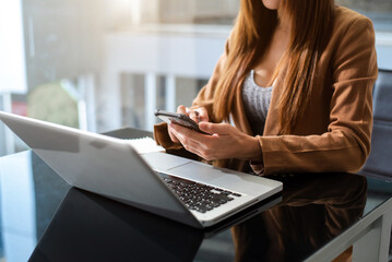 .Working Process in Modern Office. Young Woman Account Manager Working at Table with New Business Project. Typing keyboard,Using Contemporary Laptop.