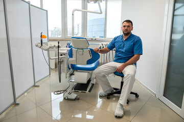 in the professional dentistry of the city, a good male dentist treats all patients' teeth.