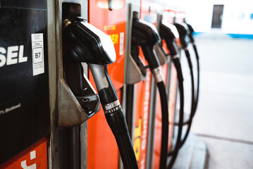 gas pump nozzles at the gas station