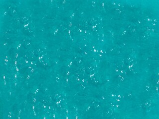 abstraction, ripples on turquoise water background,  space for text 