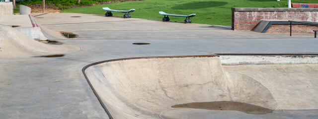 Public playground for a skateboard in a recreation park.