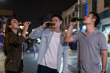 Asian attractive people drinking alcohol with friends and having party