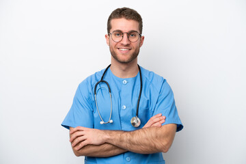 Young surgeon doctor caucasian man isolated on white background keeping the arms crossed in frontal position