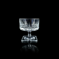 crystal antique wine glass. vintage glass goblet for alcoholic beverages on a black isolated background
