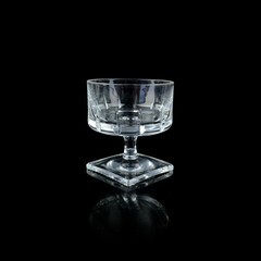 crystal antique wine glass. vintage glass goblet for alcoholic beverages on a black isolated background
