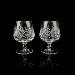 crystal antique wine glass. vintage glass goblet for alcoholic beverages on a black isolated background