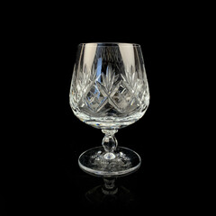 crystal antique wine glass. vintage glass goblet for alcoholic beverages on a black isolated background