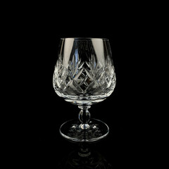 crystal antique wine glass. vintage glass goblet for alcoholic beverages on a black isolated background