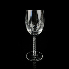 crystal antique wine glass. vintage glass goblet for alcoholic beverages on a black isolated background
