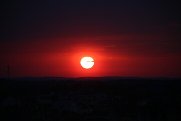 red sunset in summer in the city.