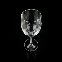 crystal antique wine glass. vintage glass goblet for alcoholic beverages on a black isolated background