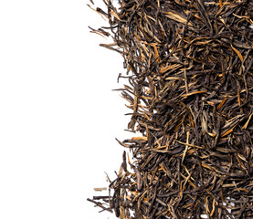 Dian Hong Jin Zhen. Red tea, golden needles on white background. Top view. Close up. High resolution