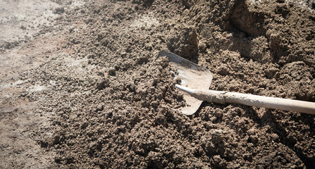 Shovel with a cement. Construction site
