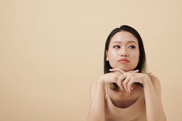 Portrait of annoyed or irritated young woman looking away