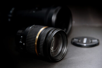 Fototapeta na wymiar 17-50 range and telephoto lenses for digital SLR digital cameras, separately on black background