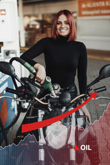 Fototapeta na wymiar Portrait of female biker refueling her bike in gas station. Price increase of oil and fuel.