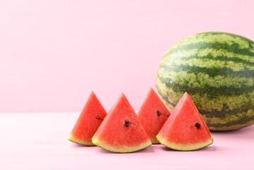 Sliced watermelon on pink color background, Tropical fruit in summer season