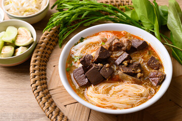 Northern Thai food, Spicy rice noodles soup with pork eating with fresh vegetables, Local Thai food