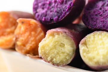 Purple, orange and yellow sweet potatoes ready to eating