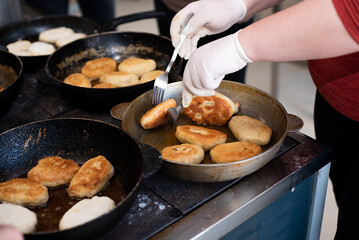 cooking fried pies with potatoes and cabbage in the dining room kitchen