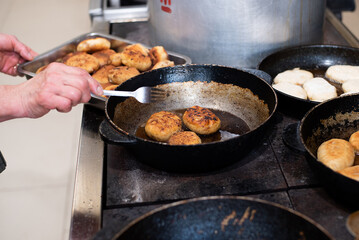 cooking fried pies with potatoes and cabbage in the dining room kitchen