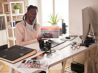 Male photographer working in home office