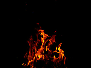 Abstract flame of fire from a campfire on a black background