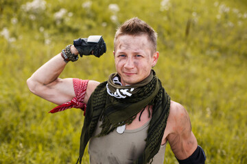 man shows strength and muscles on his arm