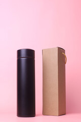 Tumbler box with black thermos tumbler isolated on pink background.Realistic set mock up for branding,  template for your design, presentation, promo, ad.