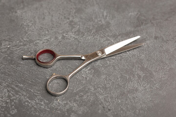 Stylish Professional Barber Scissors, Hair Cutting on black background. Hairdresser salon concept