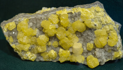 Yellow crystal of sulfur. Close-up, background and texture of the mineral