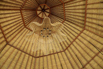 Traditional wooden rattan lamp decoration at roof 