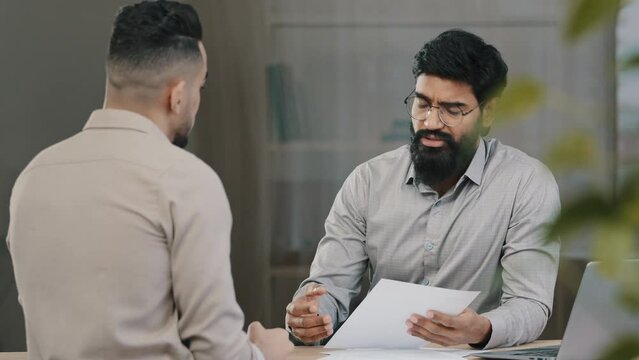 Arabian male financial consultant executive analysts expert lawyer man offer client customer insurance paperwork explain commercial investment deal business benefit at bank loan negotiation meeting