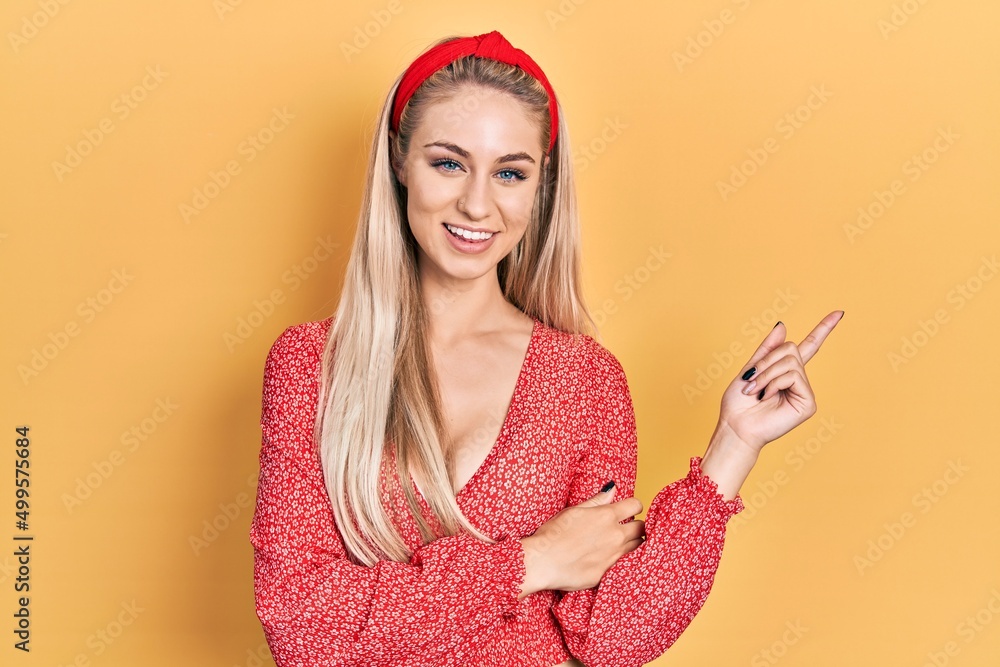 Poster young beautiful caucasian woman wearing summer dress smiling happy pointing with hand and finger to 