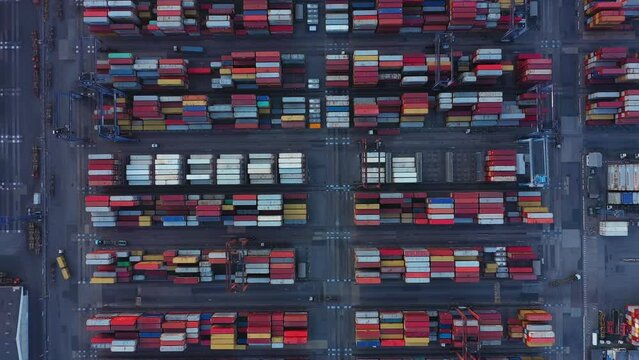 Aerial top view of container cargo ship in the export and import business and logistics international goods in urban city. Shipping to the harbor by crane in Laem Chabang, Chon Buri, Thailand
